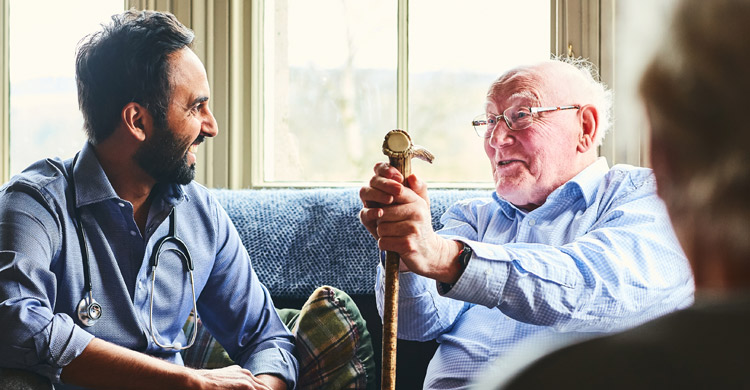 Memory Care at Prairie House - Elderly gentleman talking to his doctor